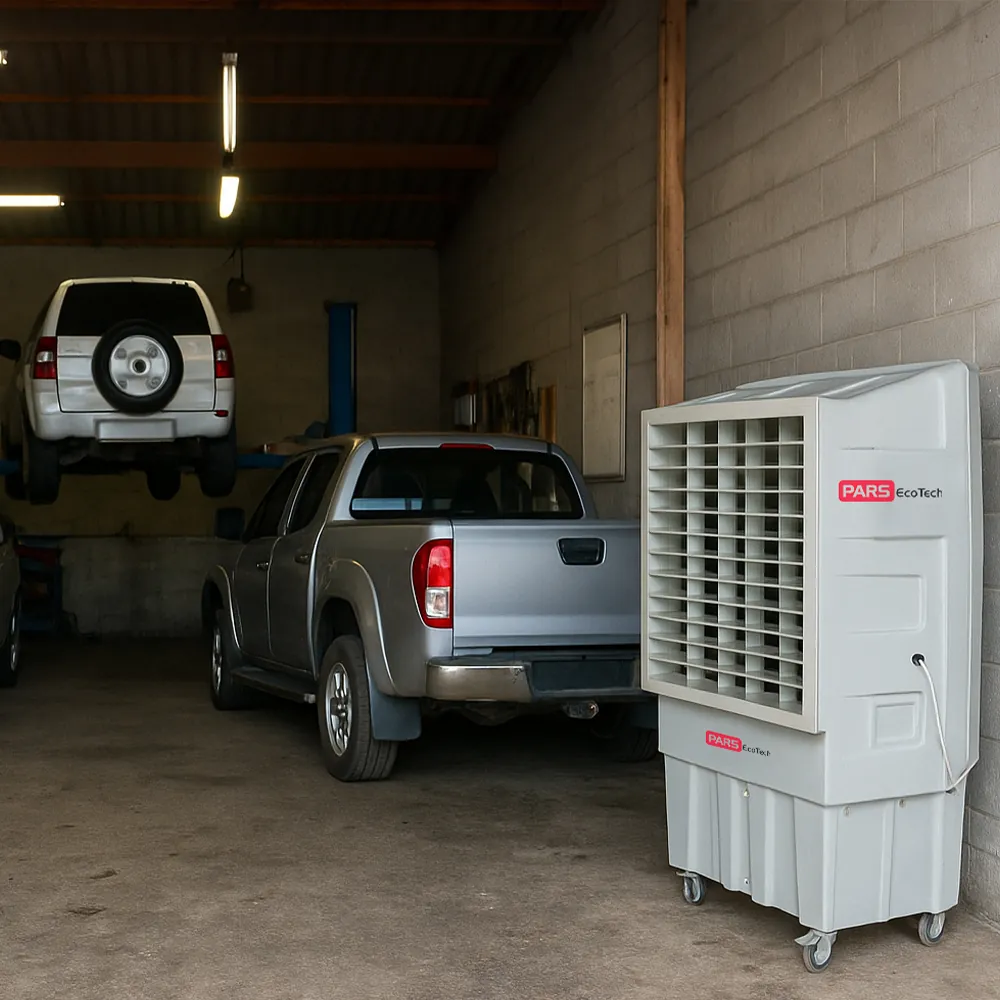 Climatizador evaporativo ECO-26000 en un garaje mecánico junto a una furgoneta y un todoterreno elevado