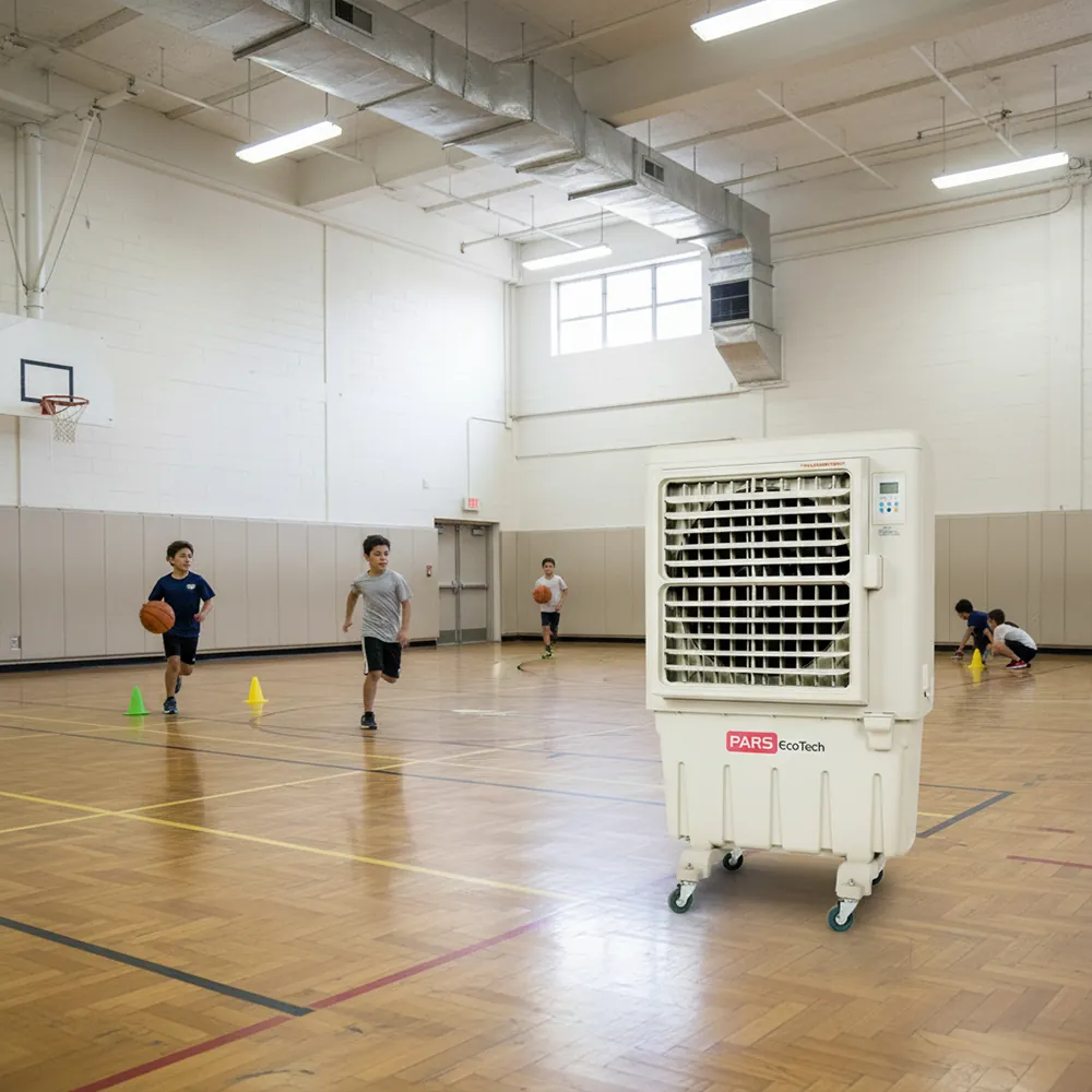 Climatizador evaporativo ECO-9000 en un pabellón deportivo con niños jugando en la pista