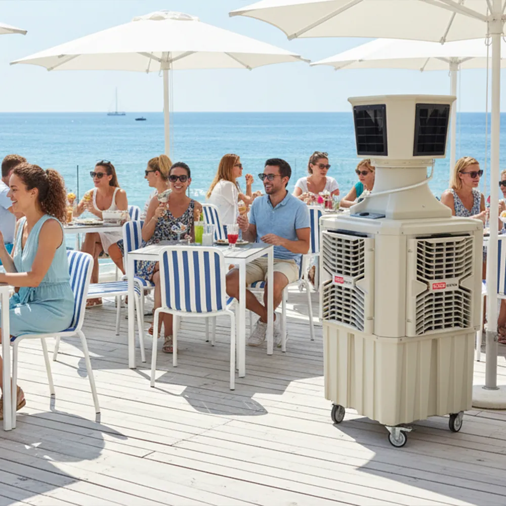 Climatizador evaporativo ECOlounge-6000 en una terraza junto al mar con sombrillas blancas y clientes sentados